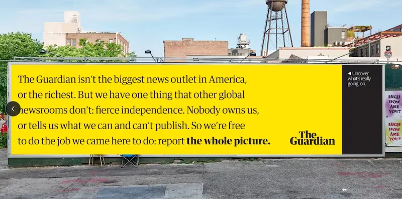 The Guardian billboard after censorship tape removed, showing full message
